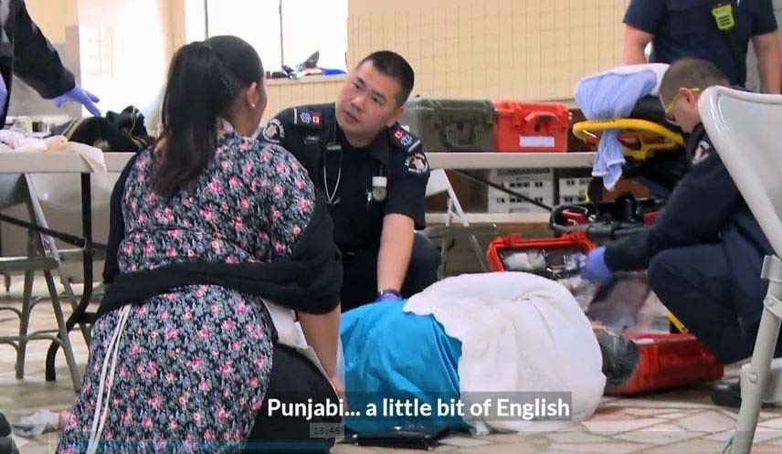 Dealing with language barriers is part of everyday life as a paramedic in Richmond for James Fang (centre) and Kin Leung. Screenshot