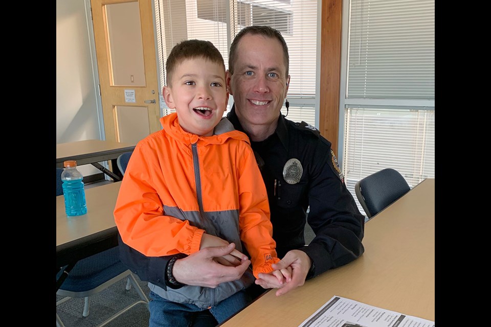 Port Moody police officer Rob DeGoey with his son, Keyen, who's on the autism spectrum.