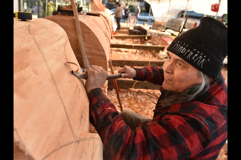 Squamish First Nation artist Xwalacktun is teaming up with his son James Harry and school-aged kids from across Vancouver to carve a 44-foot welcome post that will be erected outside the Vancouver School Board office.