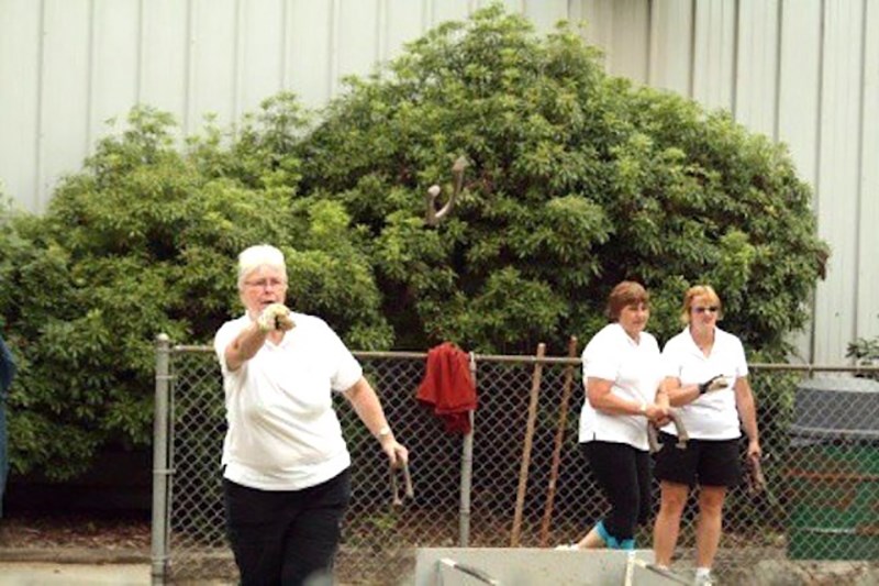 Diane Norman, Irene Smith and Paige Nahornoff pitch horseshoes at Powell River Recreation Complex.