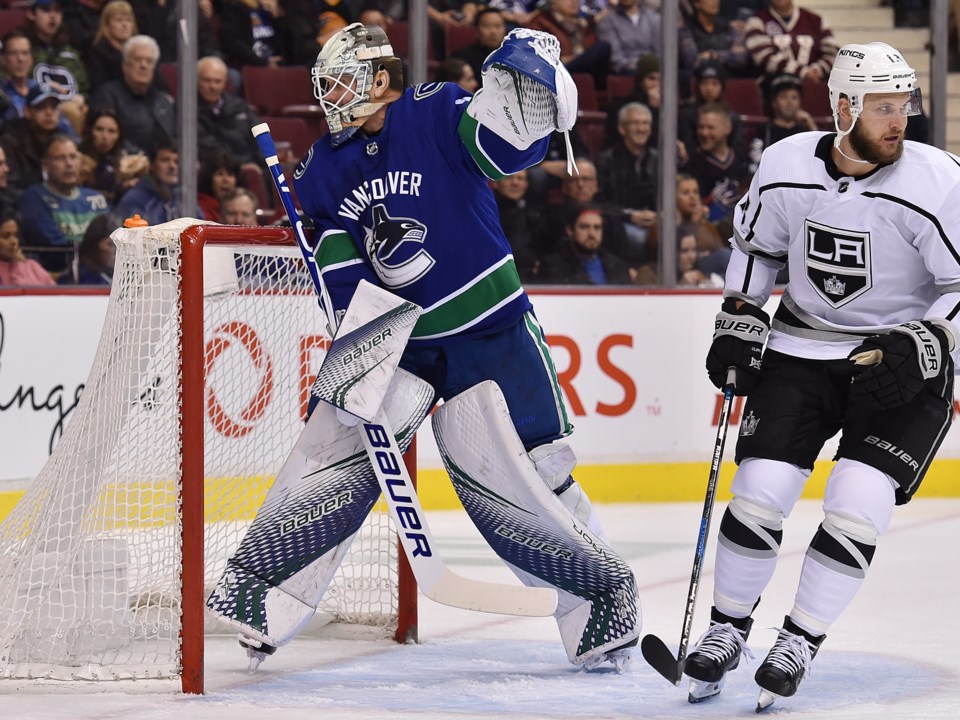 Jacob Markstrom points out something to the refs.