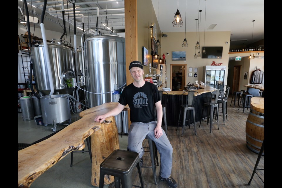VICTORIA, B.C.: April, 2, 2019 - Photos of the Sooke Brewing Company at 2057 Otter Point Rd. In the photo, John Adair, Head brewer and Co-Owner, poses in the tasting room. VICTORIA, B.C. April 2, 2019. (ADRIAN LAM, TIMES COLONIST). For Business story by Andrew Duffy.