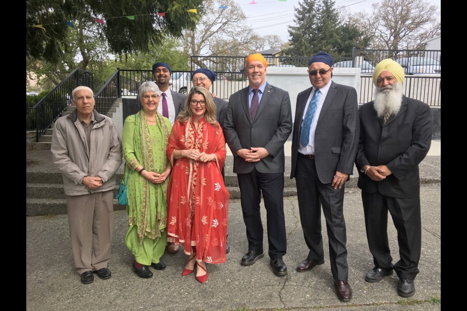 Premier Horgan, accompanied by Finance Minister Carole James and Agriculture Minister Lana Popham, attend Vaisakhi celebrations Sunday at Sikh temple on Topaz Avenue. Temple president Hardeep Sahota is second from right; Raghbir Bains is at far right. Gurbaksh Dosanjh is at far left. Delta North MLA Ravi Kahlon and Victoria MP Murray Rankin are in background.