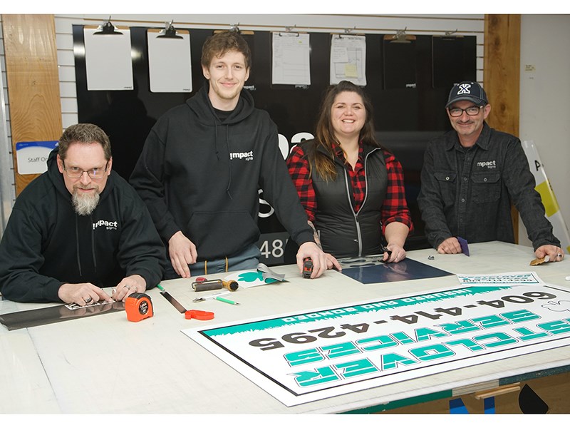 Impact Signs staff members [from left] Jason Law, Jaden Crooks, Amanda Fischer and Mike Chisholm.