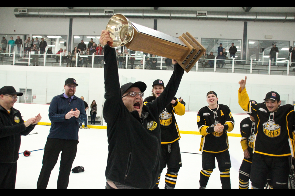 Doug Lambert raises the NPHL Senator’s Cup in joy, to the delight of the Huskies, after the team beat the County of Grande Prairie Kings 8-1 on March 23, 2019.