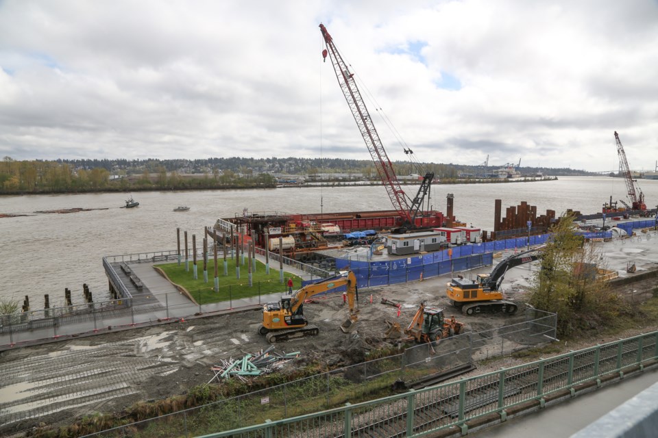 A former children's play area in Westminster Pier Park, shown in the foreground, is now a construction zone, as it's where a pedestrian/cyclist overpass will land. A new playground will be built once the structure, which starts on the Front Street parkade and takes people over the train tracks into the park, is in place.