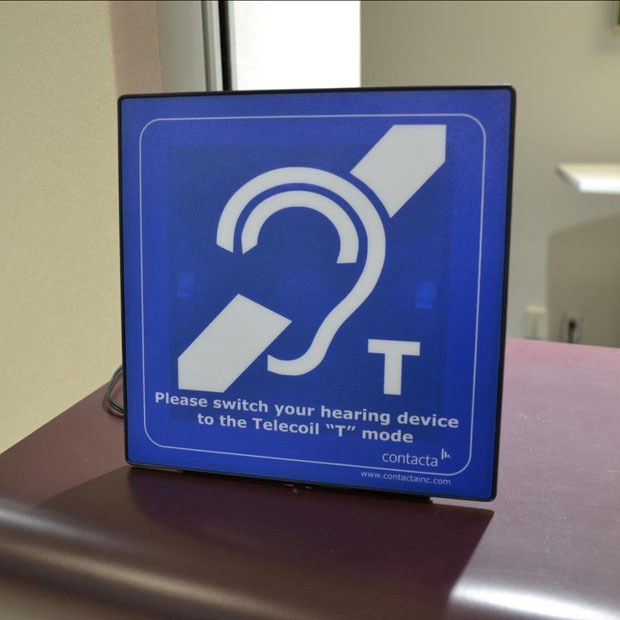 Hearing and counter loop locations at city facilities are marked with a sign featuring the universal symbol for hearing loops in areas where loops are active.
