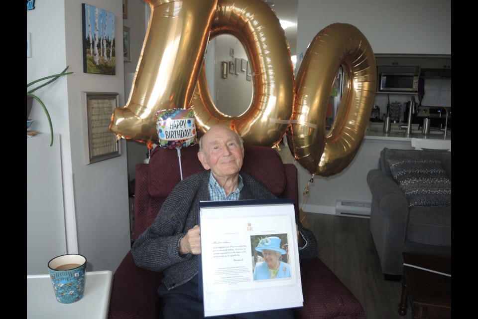 Jim Acheson turned 100 on Monday. Showing off his telegram from the Queen, he pointed to his love of potatoes and dislike for junk food and gravy as key ingredients to his longevity. Alan Campbell photo