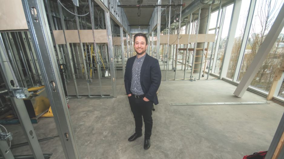 Yosh Kasahara, Pavilion Cowork’s managing director, standing in the corridor of the company’s many u