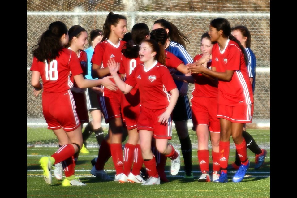 The Burnaby District Metro Select Storm celebrate a win in January, and hope to celebrate a win on Sunday in the Coastal A Cup semifinal.