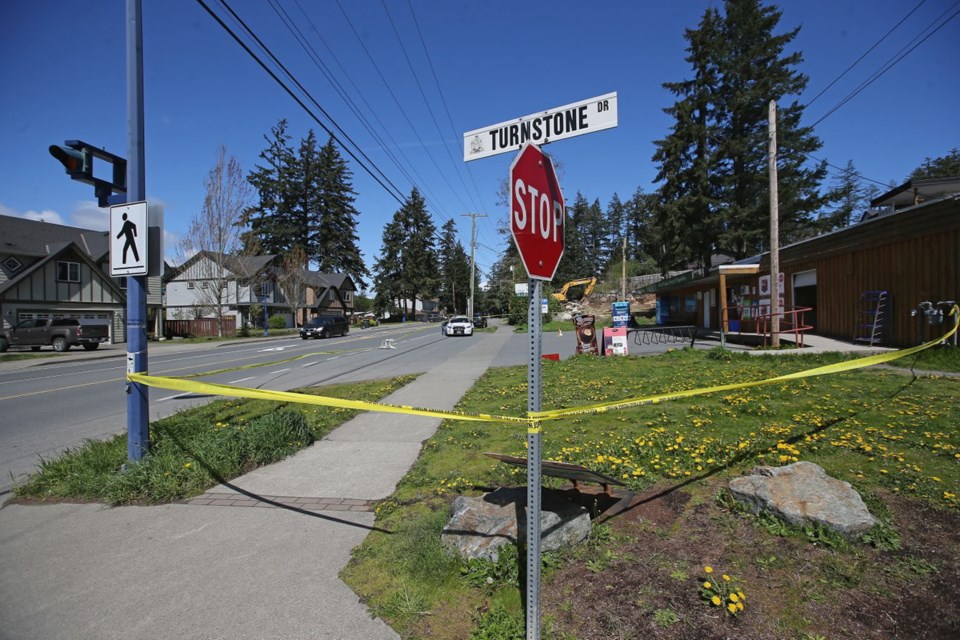 Police investigate the scene of a shooting outside the Happy Valley Market on Happy Valley Road near Turnstone Drive in Langford on Tuesday, April 23, 2019.