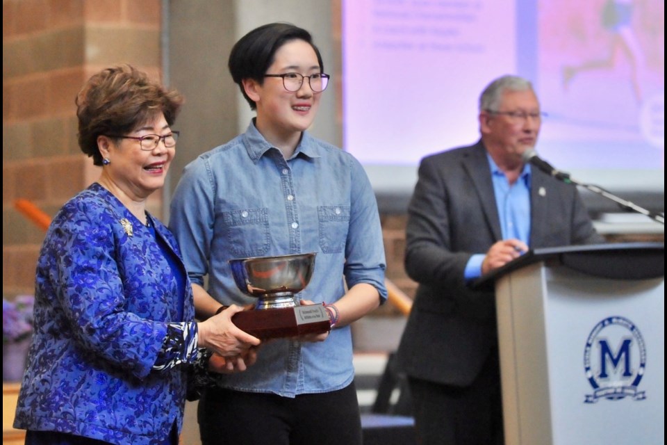 MP Alice Wong presented the co-winner of the Female Youth Athlete of the Year to short track speed skater Lan-Vi Nguyen during Thursday night's Richmond Sports Awards banquet.