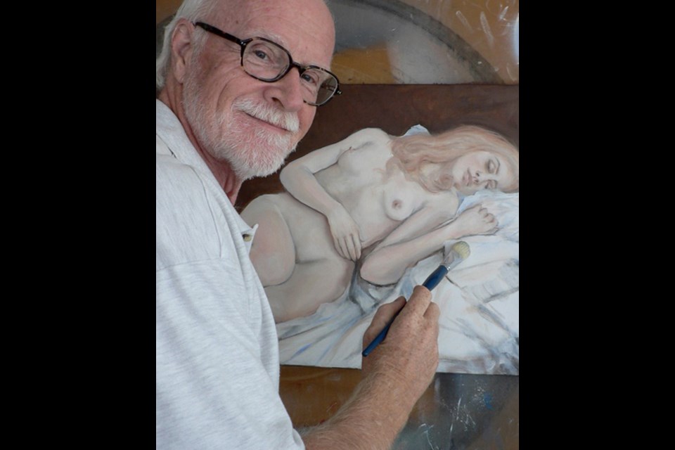 Tom Morgan at work. An exhibition of Morgan's paintings is on display at Plaskett Gallery for the month of May.