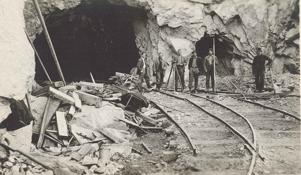 Workers at the end of the Buntzen tunnel.