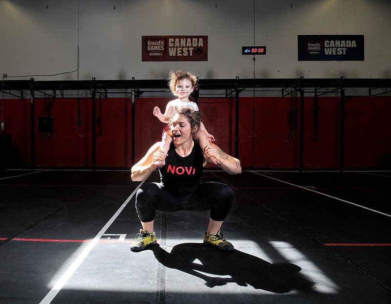 Mario Bartel's image of crossfit athlete Amanda Smith working out with her daughter, Brooklyn, was awarded the best portrait/personality photo at Saturday's Ma Murray newspaper awards.