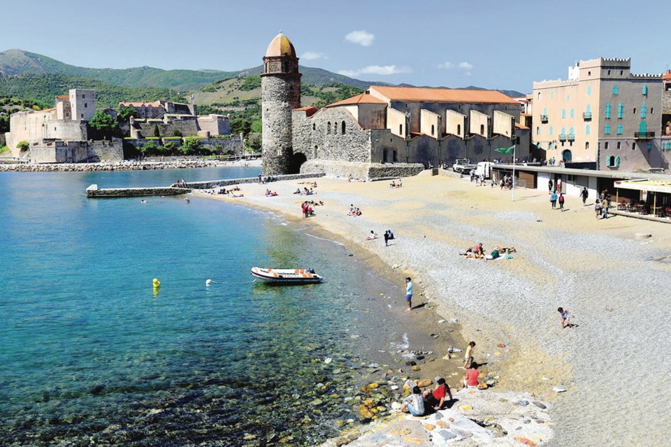 Collioure's sand-and-pebble beach ends at the Notre-Dame des Anges church &mdash; a view that has inspired many modern artists.