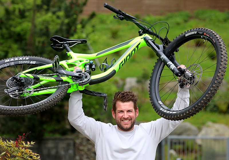 MARIO BARTEL/THE TRI-CITY NEWS Port Moody's Geoff Livingston conquered the Continental Divide on his mountain bike last summer, then conquered cancer when doctors found a tumour on his kidney last November. He's embarked on a month-long workout regime as part of Workout to Conquer Cancer.