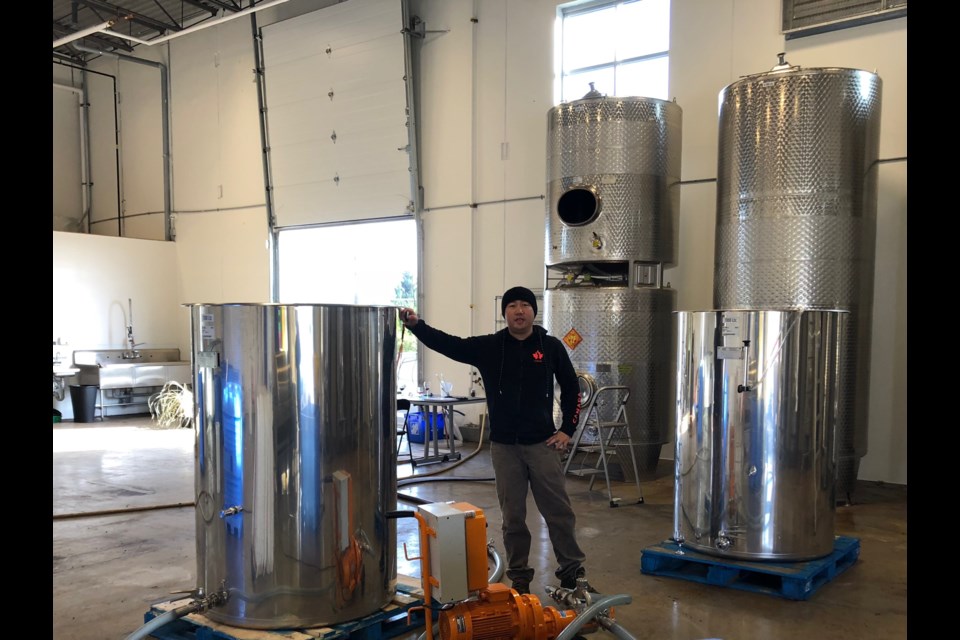 Frank Shang, owner of Richmond-based Fraser Sun Winery is getting ready to bottle 30,000 litres of blueberry wine. Photo: Submitted
