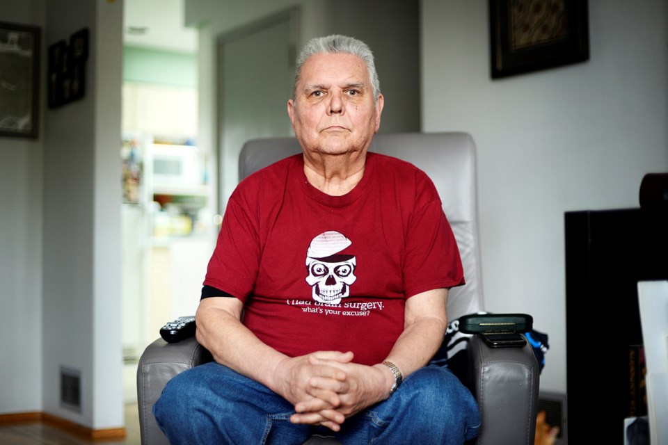 Coun. Nick Volkow wears a t-shirt reading "I had brain surgery. What's your excuse?"
