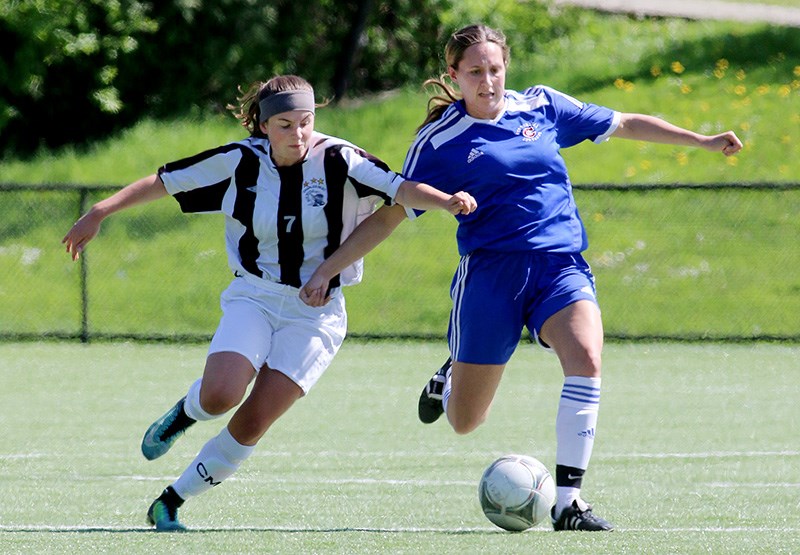 MARIO BARTEL/THE TRI-CITY NEWS Centennial Centaurs' Jessica Towner gets a step on Dr. Charles Best midfielder Alyssa Brooks in the first half of their match Wednesday in the Fraser Valley championships. Centennial won the game, 3-0, to assure them of a spot in the provincial championships at the end of May.