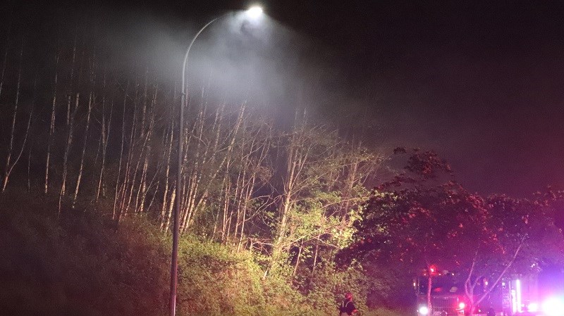 Burnaby firefighters on Burnaby Mountain on Friday night. SHANE MACKICHAN PHOTOS