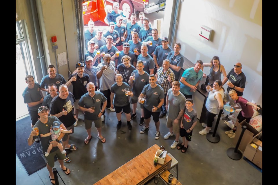 PoCo firefighters gather at Northpaw Brew Co. to celebrate the launch of their new charity beer, 'Ring the Alarm'