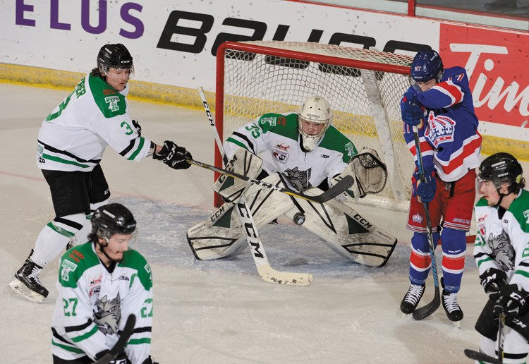 Spruce Kings winger Nolan Welsh waits for the rebound of Max Coyle's point shot on Portage Terriers goalie Nathan Moore, while surrounded by Terriers during a second-period power play. Welsh got to the loose puck and tapped it on for the Kings' fourth goal in a 5-1 victory Wednesday at the national junior A hockey championship in Brooks, Alta.