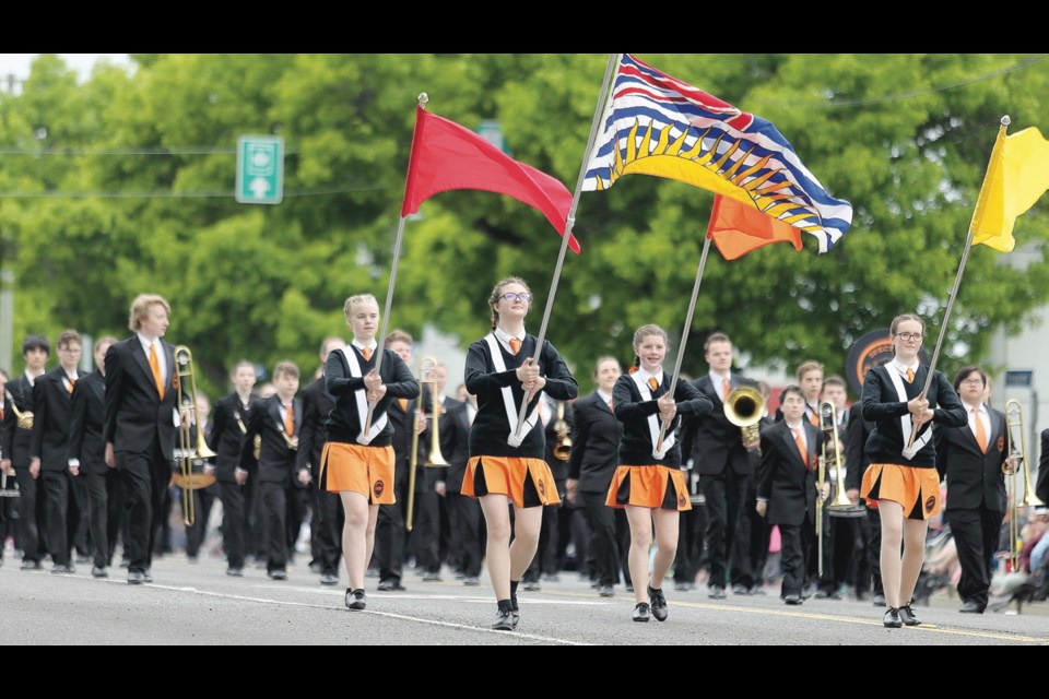 The Spectrum Community School marching band participates in the 2018 Island Farms Victoria Day Parade along Douglas Street.