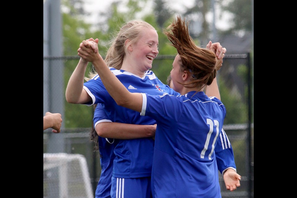 MARIO BARTEL/THE TRI-CITY NEWS Centennial Centaurs midfielde Raegan Mackenzie celebrates with teammates her first half goal on a direct free kick that proved to be the winner in their 2-0 victory over Panorama Ridge in Thursday's Fraser Valley senior girls AAA soccer championship in Cloverdale.