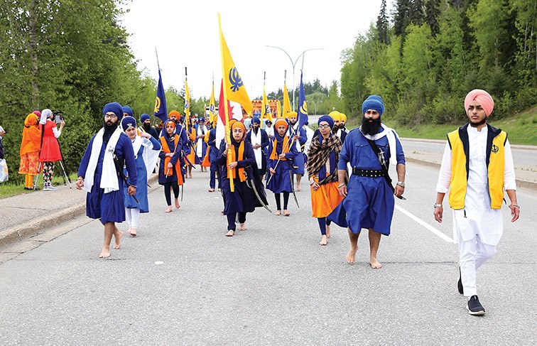 The Guru Nanak Darbar Sikh Society of Prince George Nagar Kirtan - Vaisakhi Parade makes its way down Ospika Boulevard on Saturday. Starting from Guru Nanak Darbar Gurdwara on Davis Road, the parade made its way down Ospika Boulevard to CN Centre for announcements, displays, and food booths. CItizen Photo by James Doyle