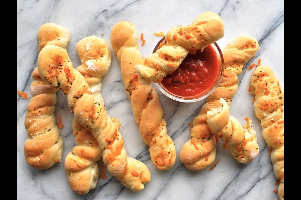 These tasty bread sticks are flavoured with Italian cheese and herbs.