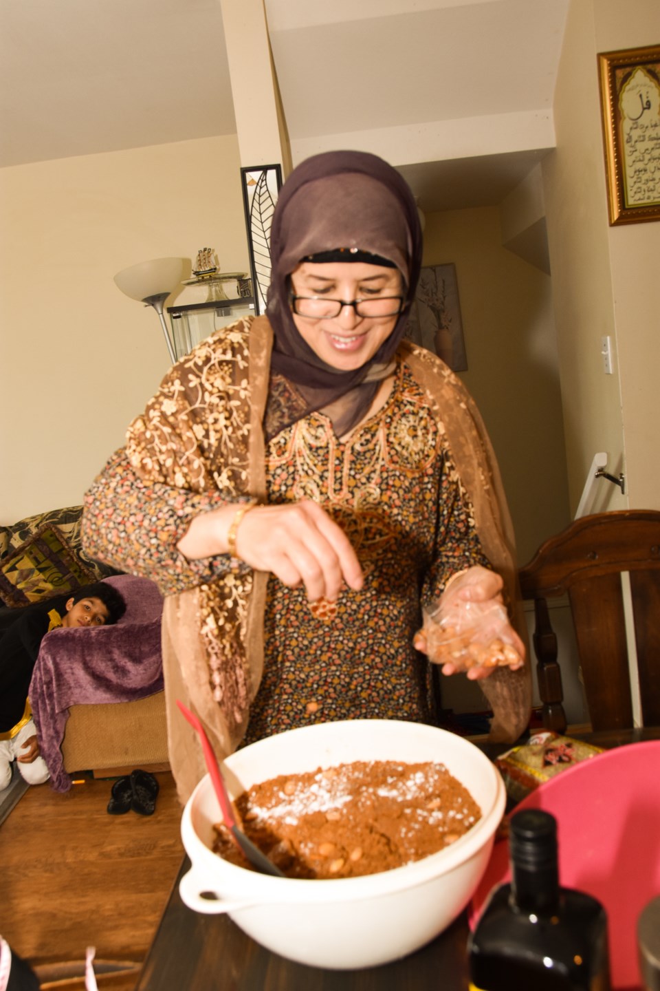 Mahsoune prepares Moroccan sellou, a nutritional sweet made with a mix of roasted flour, butter, hon