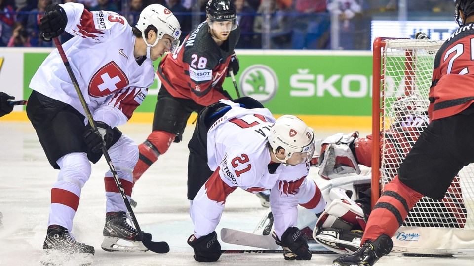 Damon Severson and Darnell Nurse defend the Team Canada net.