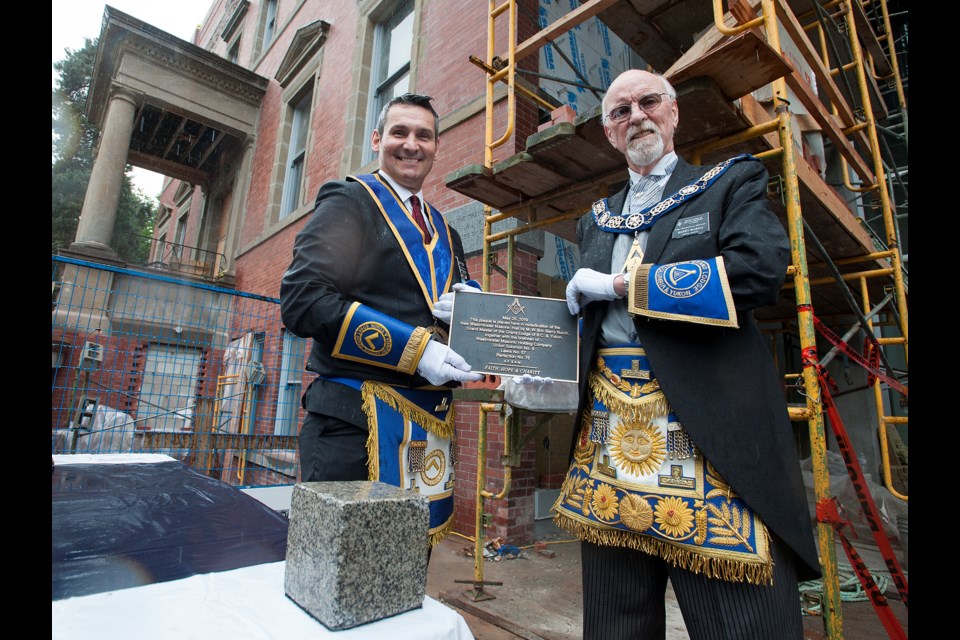 Grand Master Barry Burch and District Deputee Grand Master Scott Marshall were among the local freemasons and representatives from the Grand Lodge of British Columbia and Yukon who gathered to rededicate a cornerstone on the freemason hall at 508 Agnes St. in 1912 on Saturday. The plaque was removed from the building when redevelopment of the site got underway.