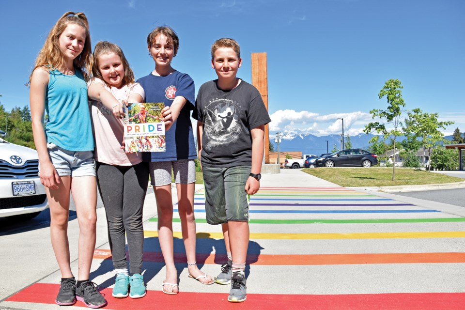 Jessica, Madeline, Maya and Johnathan, students in Colleen Hourigan’s Grade 5/6 class, organized the painting of a rainbow crosswalk at Gibsons Elementary School after author Robin Stevenson presented her book, Pride.