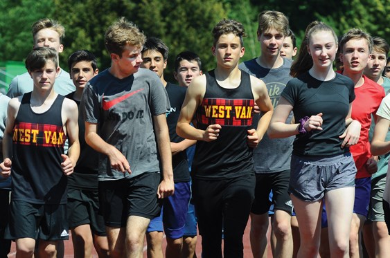 Members of the West Vancouver Secondary track and field team warm up before a recent practice. Team members and others in the North Shore track and field community are rallying around para athletes like Ges Bushe (front row, second from left) who have been excluded from this year’s high school provincial championships. photo Cindy Goodman, North Shore News