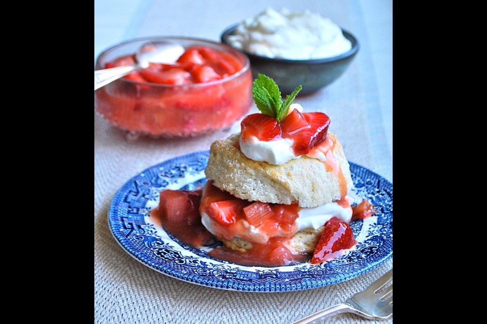 Local strawberry and rhubarb compote and whipped cream fill and top the tender shortcake.