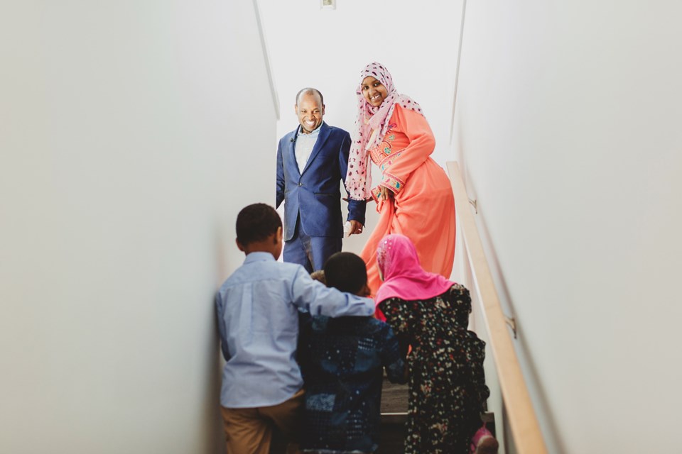 Gumatchu Taha, his wife, Dureti Mohamed, lead their three young children into their new home for the first time. Photo submitted