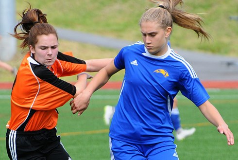 New Westminster's Sophie Crowther matches her Handsworth opponent for intensity during their provincial qualifying game in North Vancouver.