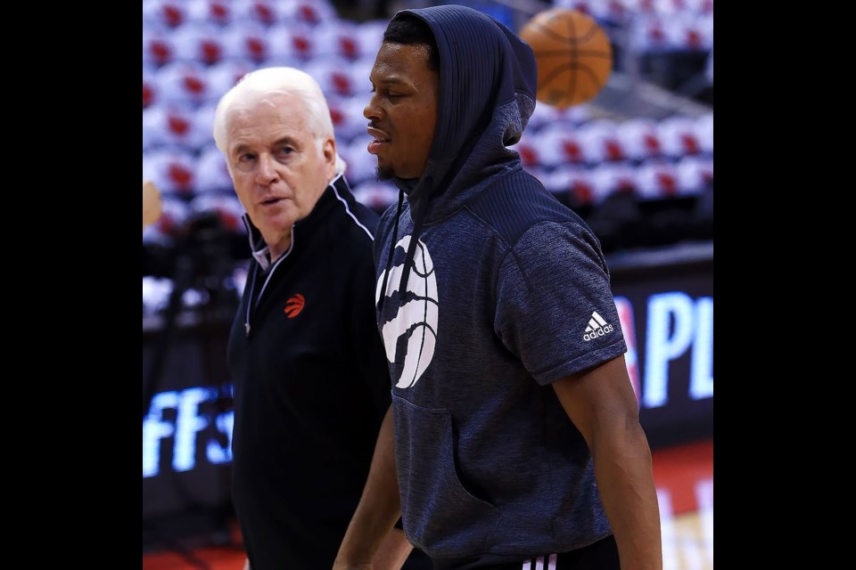 New West's Alex McKechnie talks with Toronto Raptors' Kyle Lowry during practice. McKechnie, as Toronto's assistant coach and director of sports science, is looking for his sixth NBA championship ring.