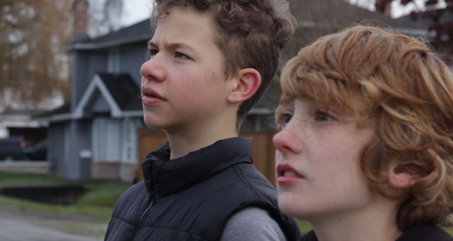 Justin Blais, 13, (left) co-stars in his own short film, along with his friend, Ethan Enns, who plays the role of the detective in Detective George. Screenshot