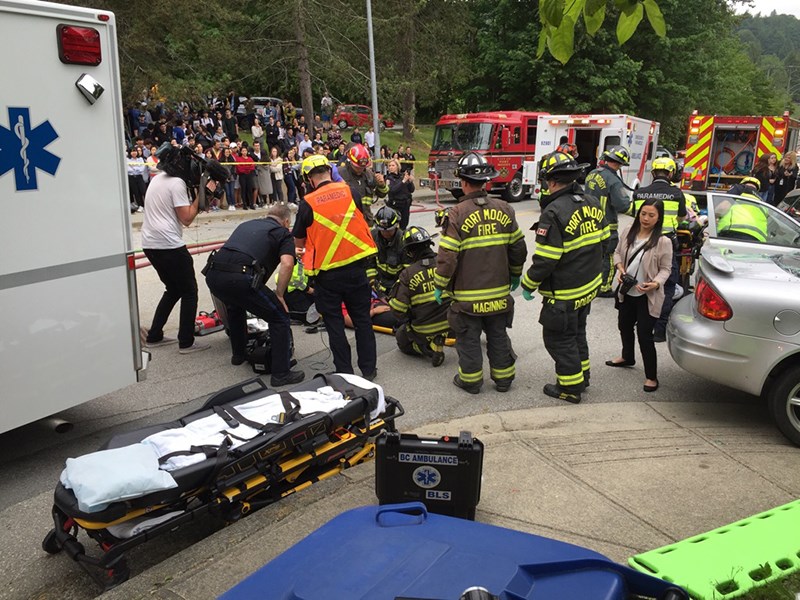 Students, Port Moody Police, Port Moody Fire Rescue and members of the BC Ambulance Service staged a mock accident outside of Port Moody secondary school Tuesday to remind students to not drive impaired.
