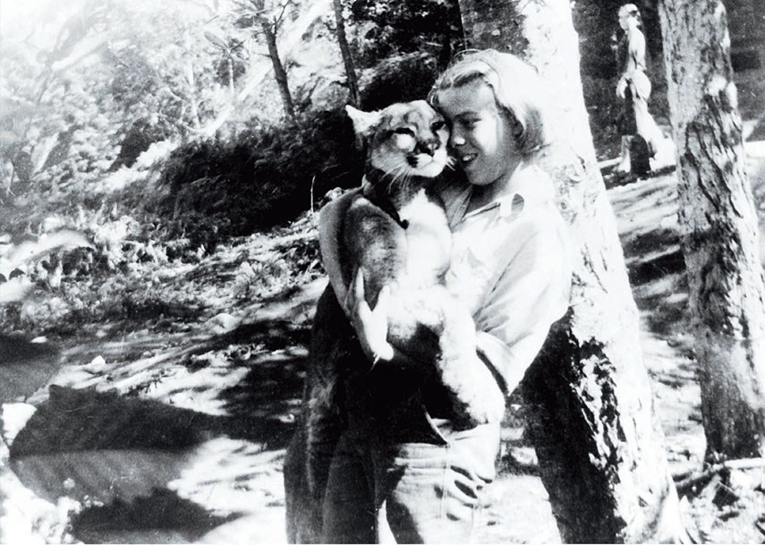 Marion with Girlie the cougar and Pearl in the backgound, c. 1937/38.