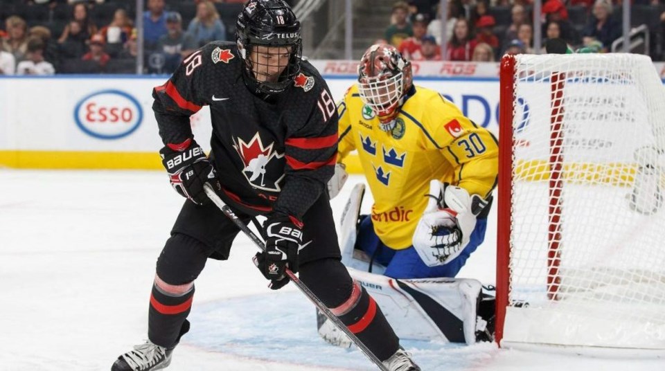 Peyton Krebs controls the puck for Team Canada at Hlinka Gretzky Cup.