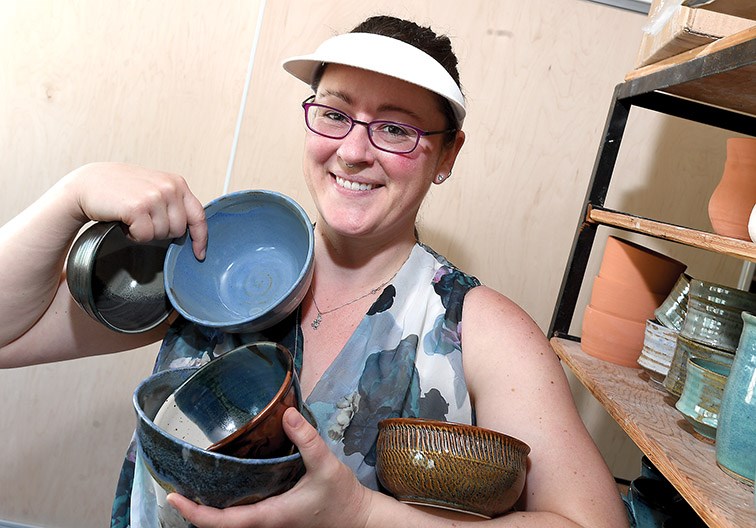 Ayla Davidson shows off some of the 500 bowls made by Prince George Potters for the 43rd Annual ChiliFest and Spring Arts Bazaar this Saturday in front of Studio 2880. The event features live music and artist demonstrations, as well as an opportunity to browse through stalls, buy your lunch by purchasing a bowl and testing all the chili in the Chili Fest, then voting for your favourite team. Peruse the stalls where local artisans are selling their wares or bring a blanket and stretch out on the grass and listen to music. Citizen photo by Brent Braaten
