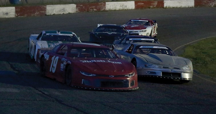 Kendall Thomas of Kelowna leads a group of cars into the front straightaway at PGARA Speedway during the 100-lap WESCAR 100 Saturday night. Chris Babcock of Fort St. John won the season-opening race.