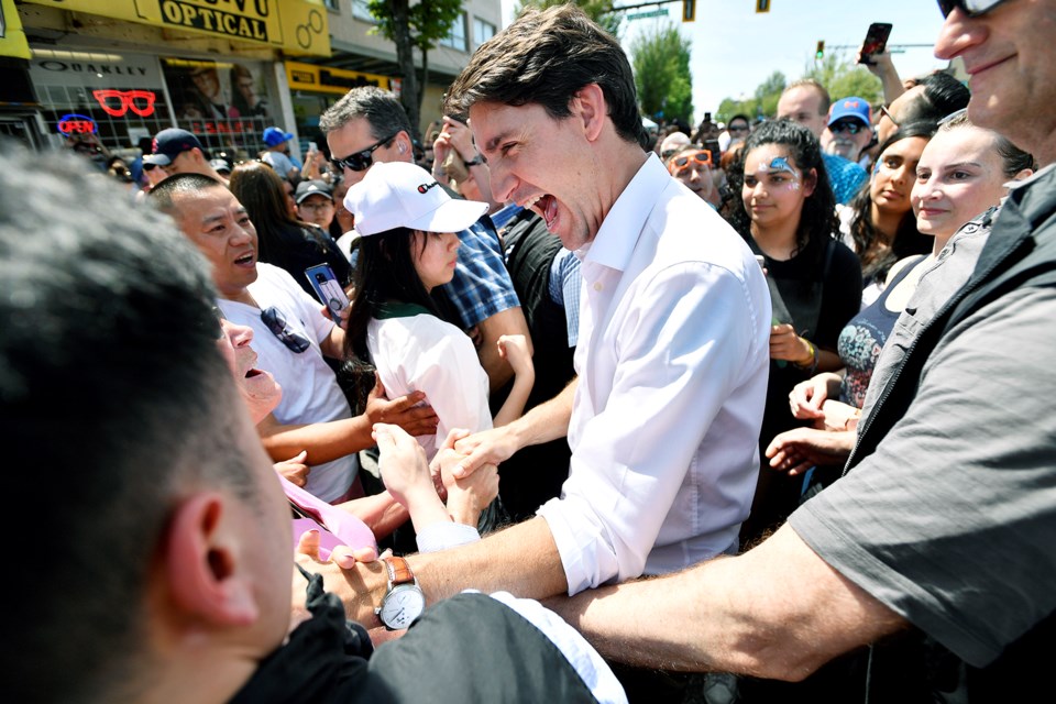 Prime Minister Justin Trudeau is mobbed by the crowd.