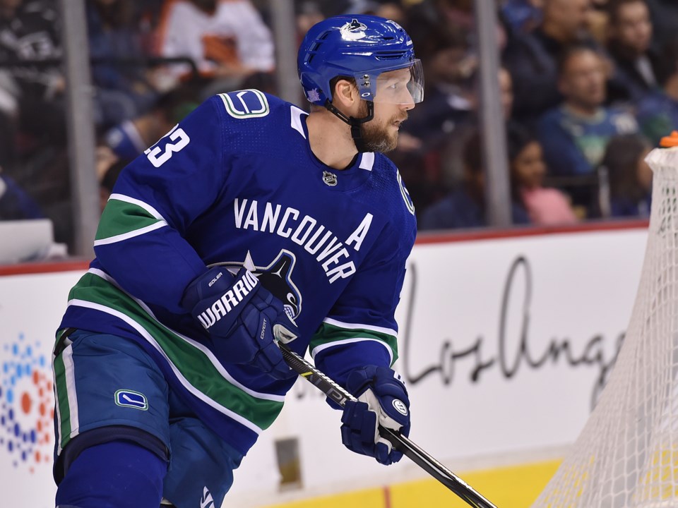 Alex Edler looks up ice for the Vancouver Canucks.