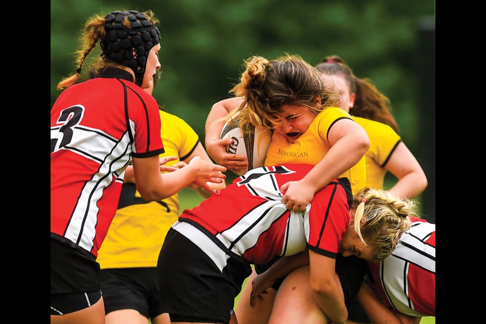 Carson Graham players make a tackle during a 20-7 loss against Shawnigan Lake in the senior girls provincial AAA rugby final. photo supplied Arden Gill/Shawnigan Lake School