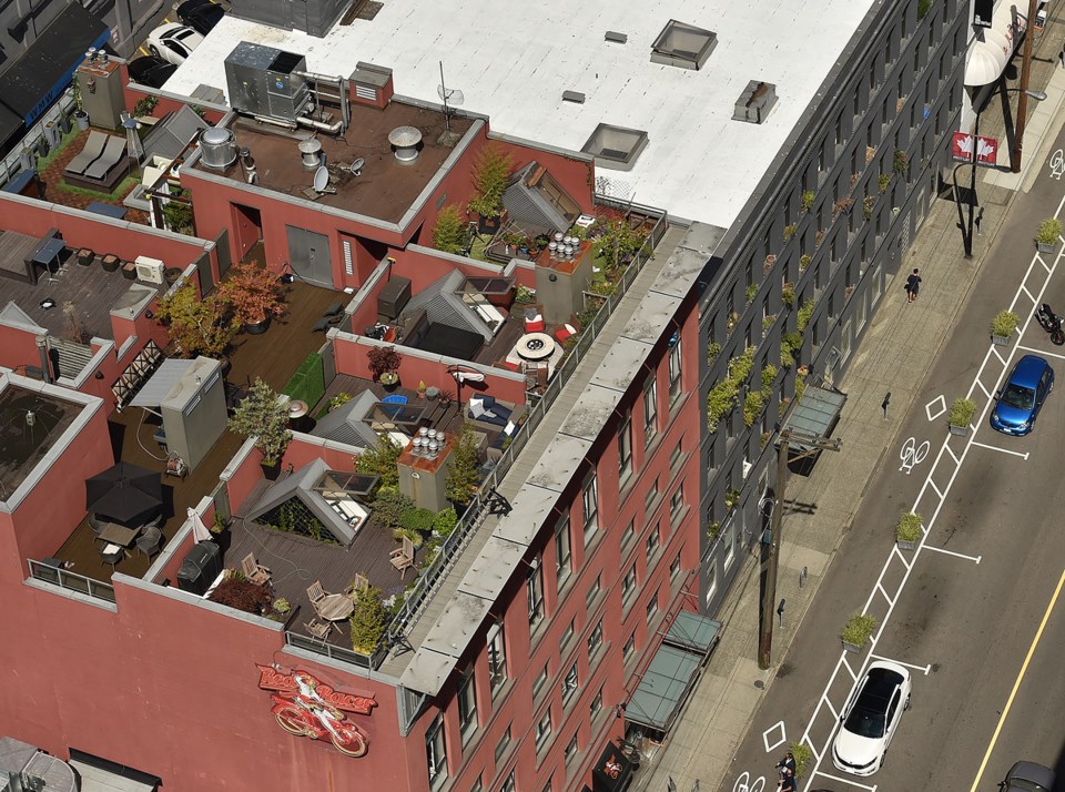 Summertime rooftop patios along a downtown Vancouver Street. Photo Dan Toulgoet